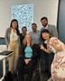 (Standing left to right)  Paige Nguyen, Brett Caviness, Liborio Millares, Roshan Revankar, Lin-Lin Tsou-Otani and Karen Trolan (center).